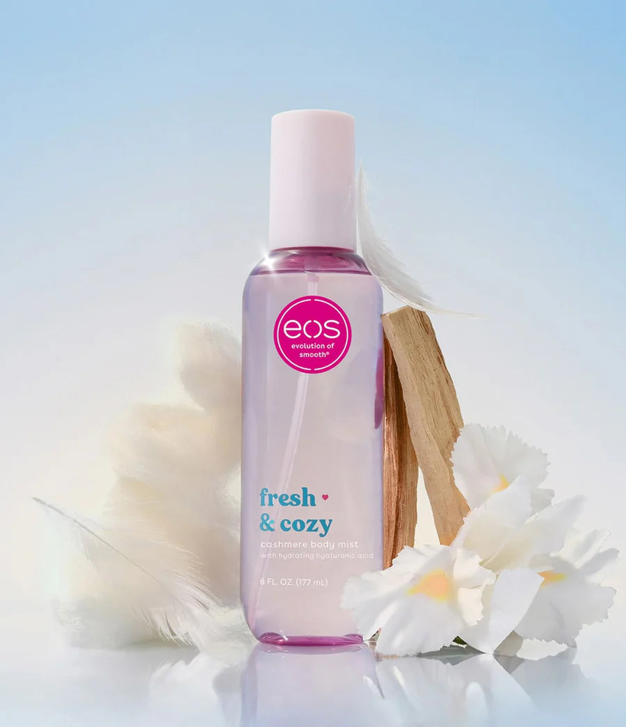 EOS fresh & cozy bottle with flowers on a light background. Purchase from americanbodycare.co.uk