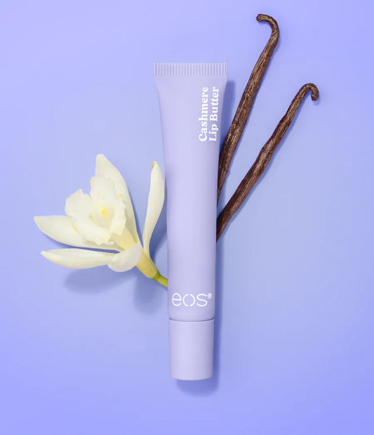 eos lip balm tube with a vanilla bean and flower on a purple background. Purchase from www.americanbodycare.co.uk