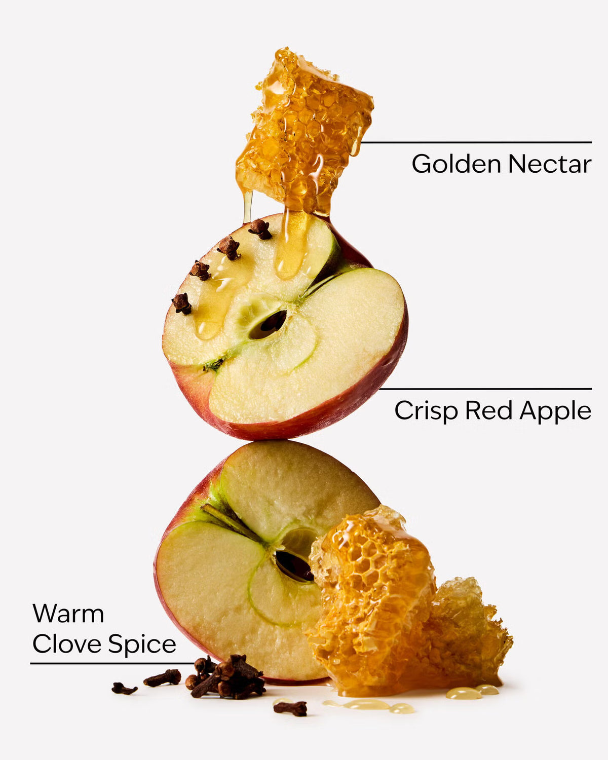 A stylized product graphic showing a sliced red apple with honey dripping from a honeycomb piece, plus clove spice and text labels reading 'Golden Nectar,' 'Crisp Red Apple,' and 'Warm Clove Spice' on a light gray background. Purchase from www.americanbodycare.co.uk