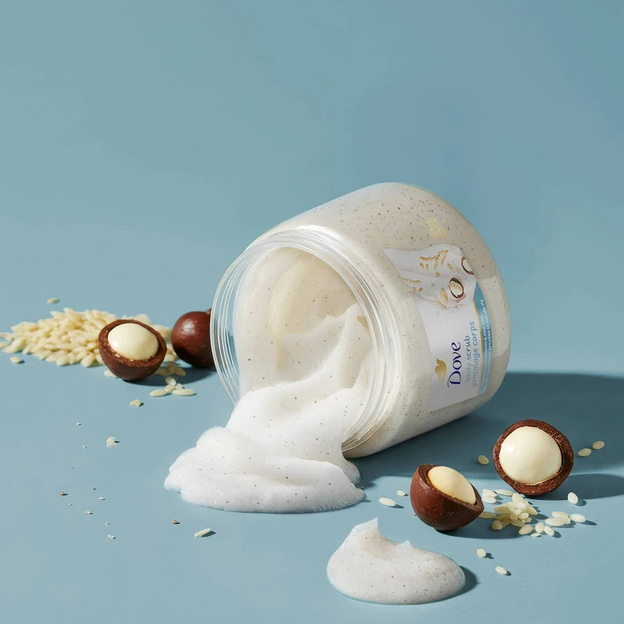 Dove body scrub with macadamia nuts on a blue background. Purchase from americanbodycare.co.uk