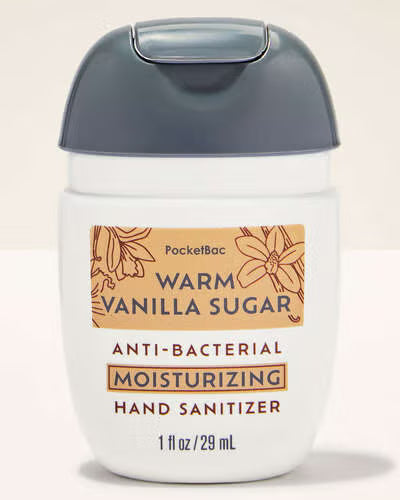 Hand sanitizer with 'Warm Vanilla Sugar' scent on a beige background. purchase from www.americanbodycare.co.uk