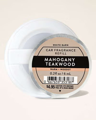 Car fragrance refill packaging labeled 'Mahogany Teakwood' on a beige background. Purchase from www.americanbodycare.co.uk 