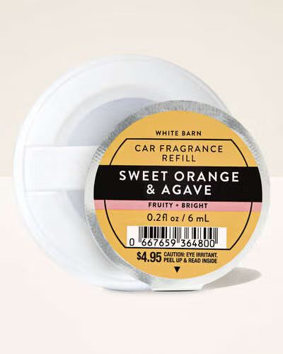 White Barn car fragrance refill container labeled 'Sweet Orange & Agave' on a beige background. Purchase from www.americanbodycare.co.uk 