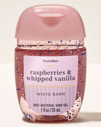 Hand gel bottle labeled 'Raspberries & Whipped Vanilla' by White Barn on a light background. purchase from www.americanbodycare.co.uk