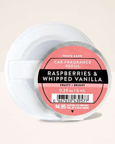 Car fragrance refill labeled 'Raspberries & Whipped Vanilla' on a beige. Purchase from www.americanbodycare.co.uk background
