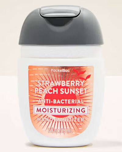 Hand sanitizer bottle with strawberry peach sunset flavour label on a beige background. Purchase from americanbodycare.co.uk 