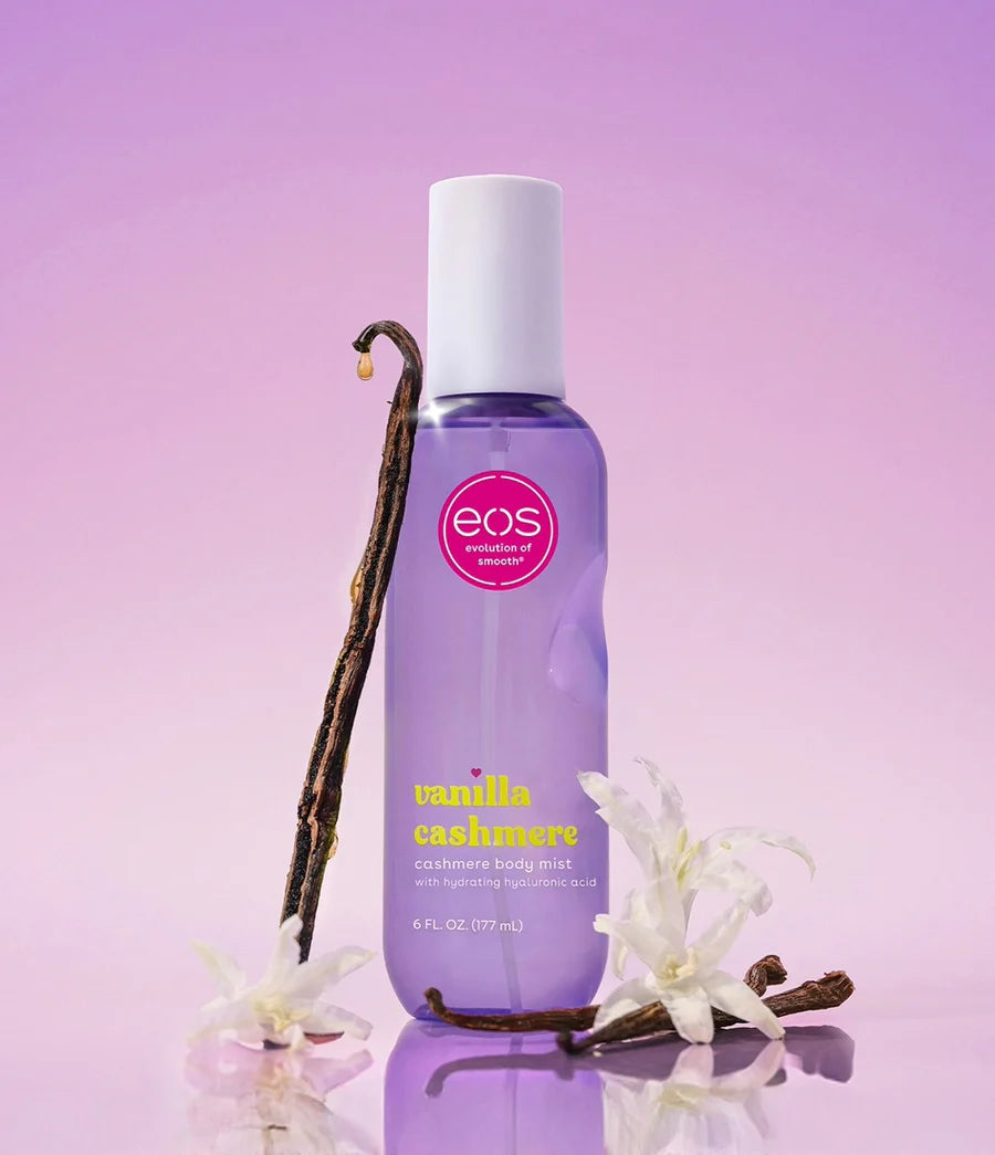EOS Vanilla Cashmere hand lotion with vanilla beans and flowers on a purple background. Purchase from americanbodycare.co.uk 