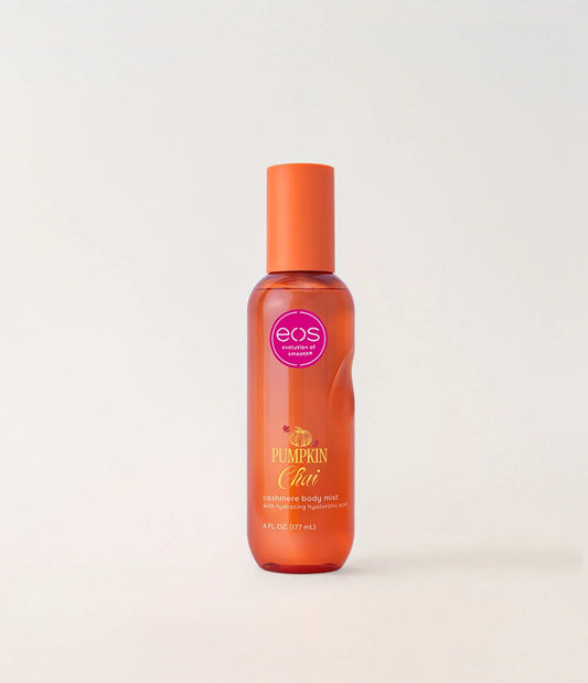 A bottle of EOS Pumpkin Chai cashmere body mist with an orange cap and orange-tinted bottle, set against a plain light background. purchase from www.americanbodycare.co.uk