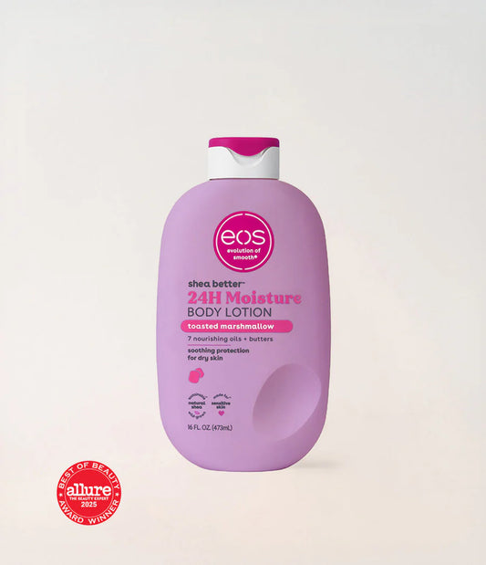 Purple bottle of eos shea butter 24H Moisture Body Lotion on a light beige background. Purchase from www.americanbodycare.co.uk 