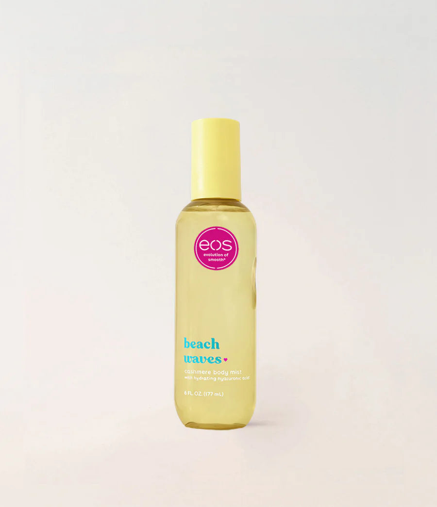 Yellow bottle of eos Beach Waves hair product on a light gray background. Purchase from www.americanbodycare.co.uk 