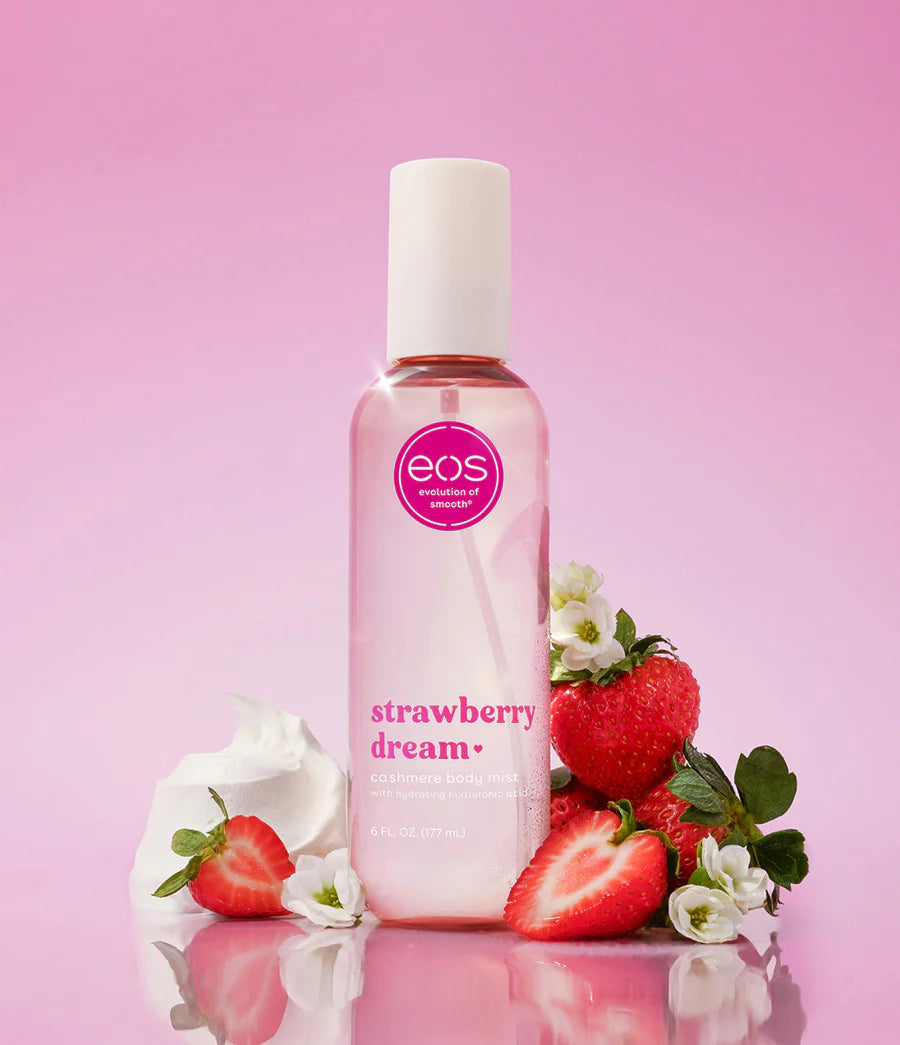 Bottle of eos Strawberry Dream lip balm with strawberries and flowers on a pink background. Purchase from americanbodycare.co.uk 