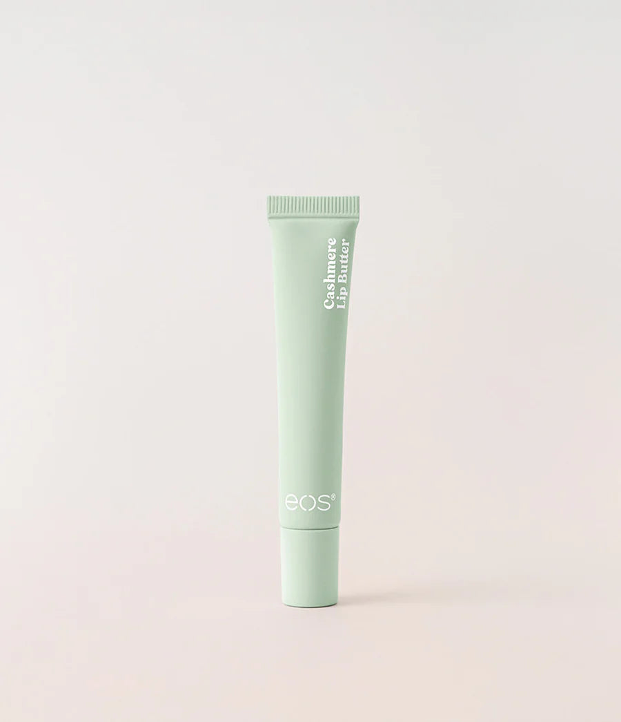 A light mint green squeeze tube of BOS Cashmere Lip Butter standing upright against a soft, light beige background. Purchase from www.americanbodycare.co.uk 