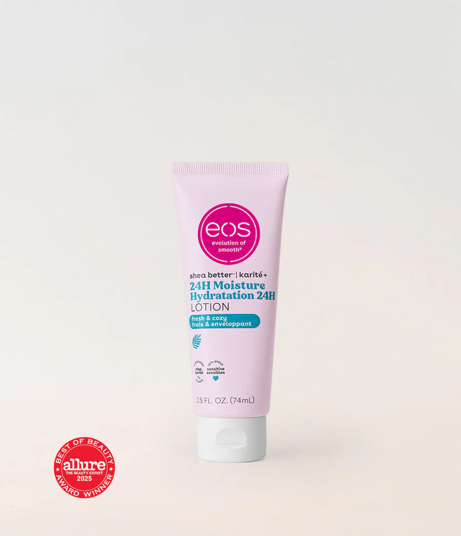 A tube of EOS Skincare 24H Moisture Lotion in a pale pink color with a white cap, set against a plain off-white background. A red 'Best of Beauty Allure 2023 Winner' badge is visible in the bottom-left corner. Bright morning glow, juicy dewy cassis, and subtle sheer musk come together to create a light, breezy fragrance — soothing, warm, and naturally fresh.