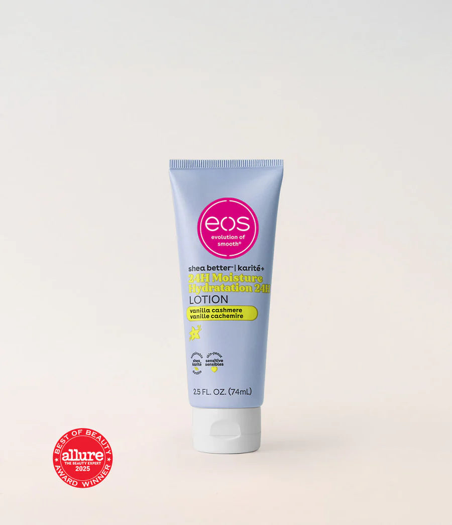 A tube of EOS Phena Better Karité Lotion 24 Hour Moisturizer on a light beige background, featuring a pink circular EOS logo and a white cap. An Allure 'Best of Beauty 2023' award seal is visible in the bottom-left corner. Purchase from www.americanbodycare.co.uk 