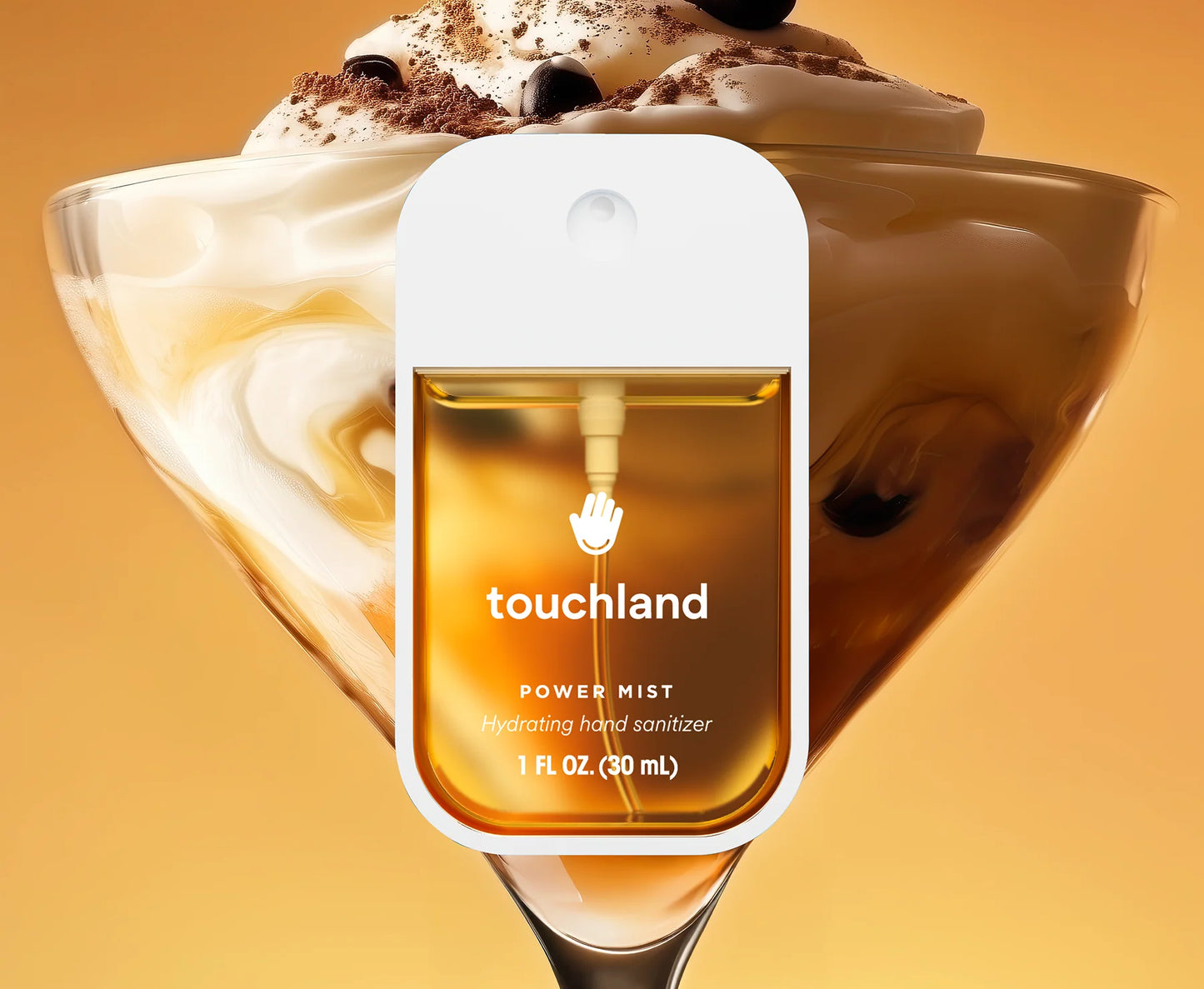 Touchland spiced pumpkin-tini hand sanitizer bottle with a dessert background. Purchase from americanbodycare.co.uk