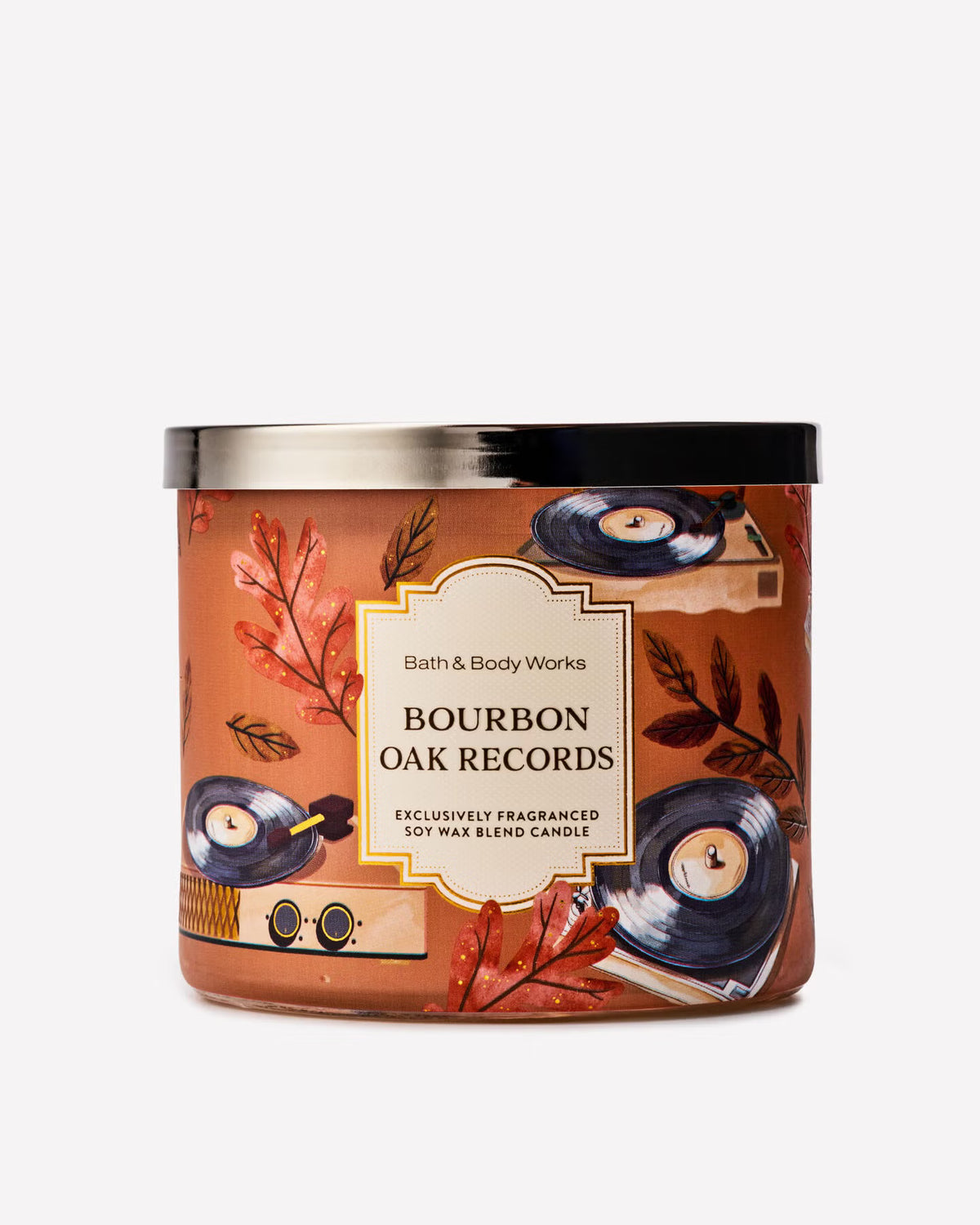 Bath & Body Works Bourbon Oak Records soy wax blend candle in a round glass jar with a black lid and a warm brown label decorated with vinyl records and autumn leaves. purchase from www.americanbodycare.co.uk