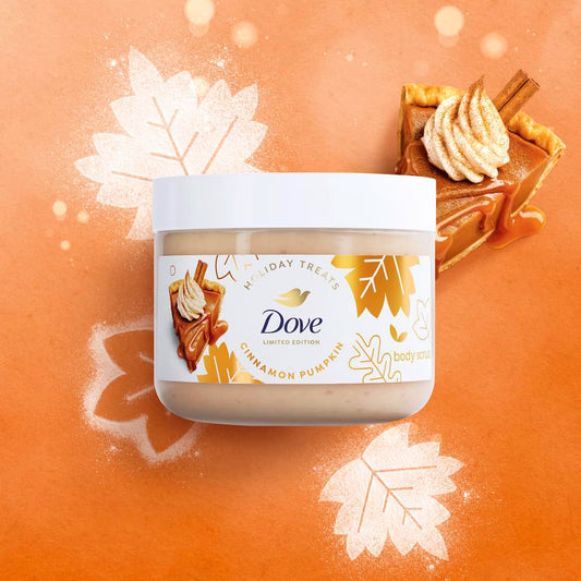 A jar of Dove Holiday Treats Cinnamon Pumpkin body butter centered on an orange background with autumn leaf graphics and a pumpkin pie illustration. The product jar is clear with a white lid and a white label featuring the Dove brand and pumpkin/cinnamon imagery.
