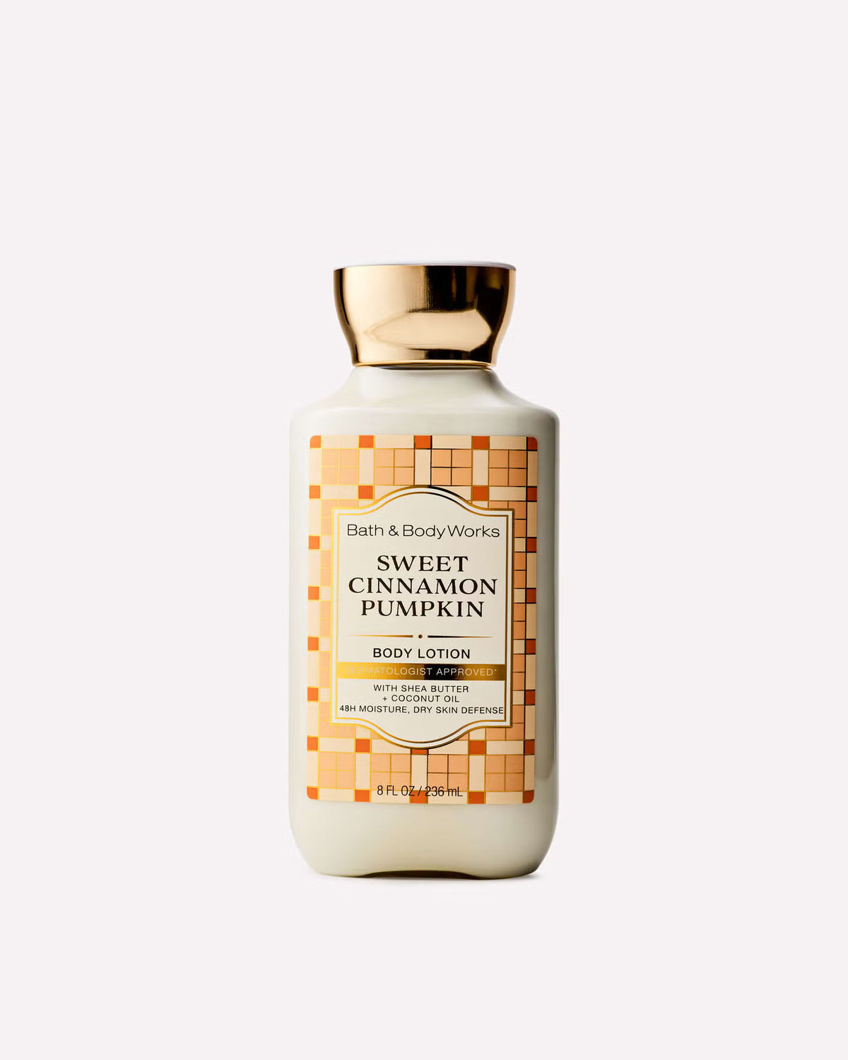 A bottle of Bath & Body Works Sweet Cinnamon Pumpkin Body Lotion with a cream-colored body, a gold cap, and an orange and beige patterned label, set against a light gray background. purchase from www.americanbodycare.co.uk