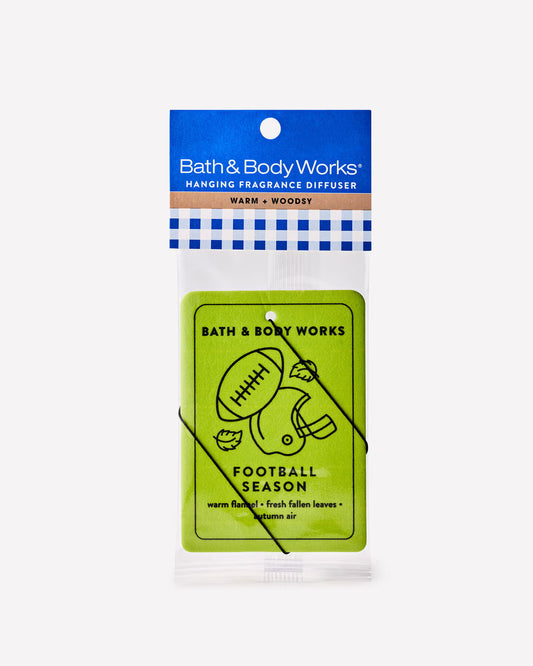 Bath & Body Works Football Season hanging fragrance diffuser in a clear plastic bag with a blue header card and a bright green insert featuring football graphics. Purchase from www.americanbodycare.co.uk
