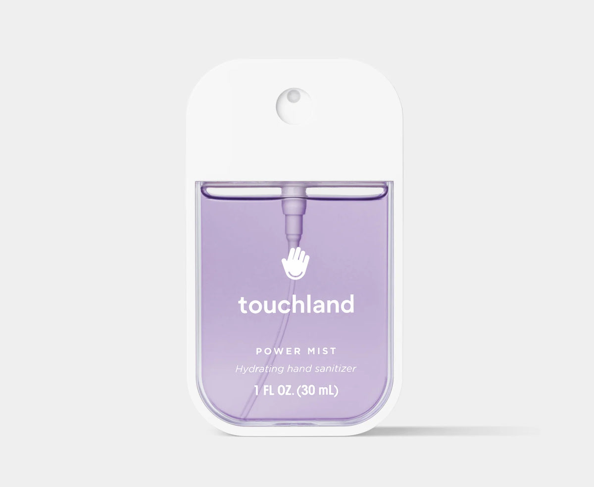 Touchland power mist hand sanitizer packaging on a light gray background. Purchase from www.americanbodycare.co.uk