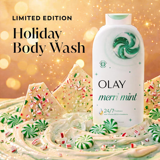 Olay Merry Mint Limited Edition Holiday Body Wash bottle displayed with festive holiday-themed props including peppermint swirls, candy canes, and white chocolate pieces on a warm golden bokeh background. A 22 fl oz bottle of Olay Merri Mint Body Wash, Limited Edition, featuring a white bottle with a green cap and a green and white swirl graphic on the front. purchase from www.americanbodycare.co.uk