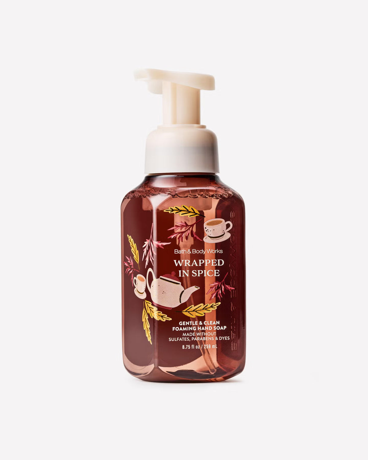 A bottle of Bath & Body Works 'Wrapped in Spice' gentle cleansing hand soap with a white pump dispenser, featuring a warm brown liquid and autumn-themed illustrations on the label. Purchase from www.americanbodycare.co.uk