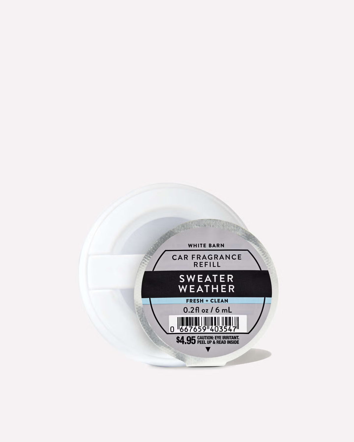 A single roll of White Barn Car Fragrance Refill in the 'Sweater Weather' scent, shown in its clear plastic container with a white plastic cap on a clean white background. purchase from www.americanbodycare.co.uk